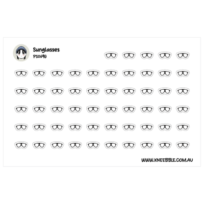 a grid of identical black and white sunglasses, arranged in rows and columns.